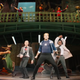 Performers dressed as the Avengers pose onstage during Rogers: The Musical, as seen in Disney+ series Hawkeye.